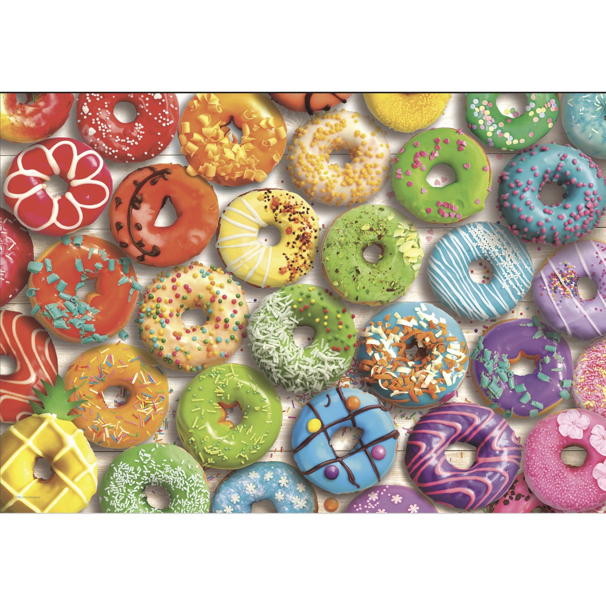 Puzzle de 550 pièces en forme de donut dans une boîte en métal.